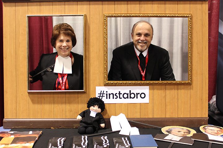 Dr. Maggie McCarty and Bro. Bob Schieler have fun in the photo booth