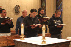 (L-R) Brothers Dan Monroe, Stephen Markham, David Deradoorian, Joseph Wright, and Patrick Martin praying