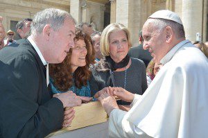 Brother William Mann, president of Saint Mary’s University of Minnesota, along with Mary Burrichter, center, and Sandra Simon, right, Saint Mary’s University trustees, presented the Signum Fidei Award to Pope Francis April 15 in Rome. Courtesy L'Osservatore Romano